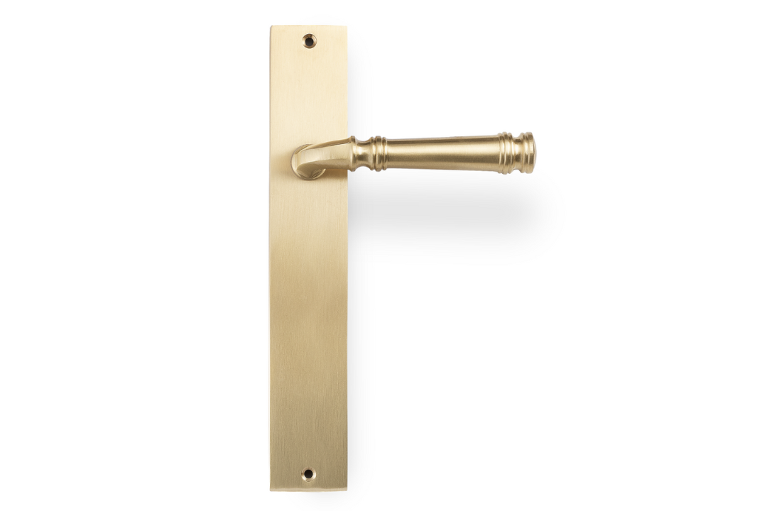 Product picture of the Apollo Design Tuscany Door Handle on Rectangle Plate Satin Brass Passage Set on a white background.