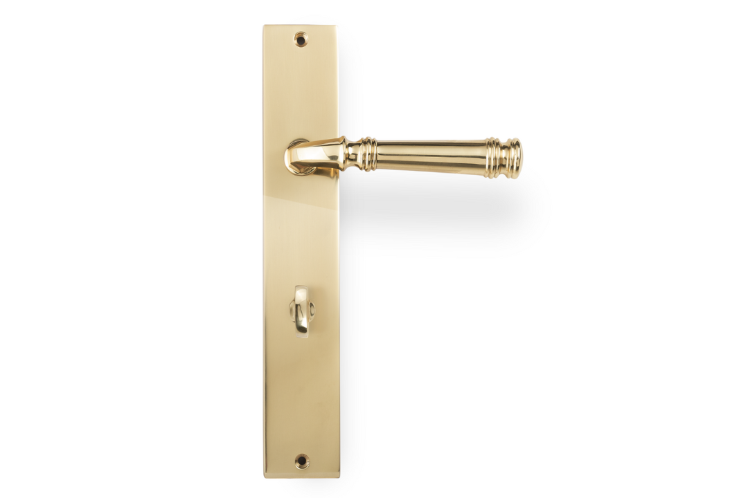 Product picture of the Apollo Design Tuscany Door Handle on Rectangle Plate Satin Brass Privacy Set on a white background.