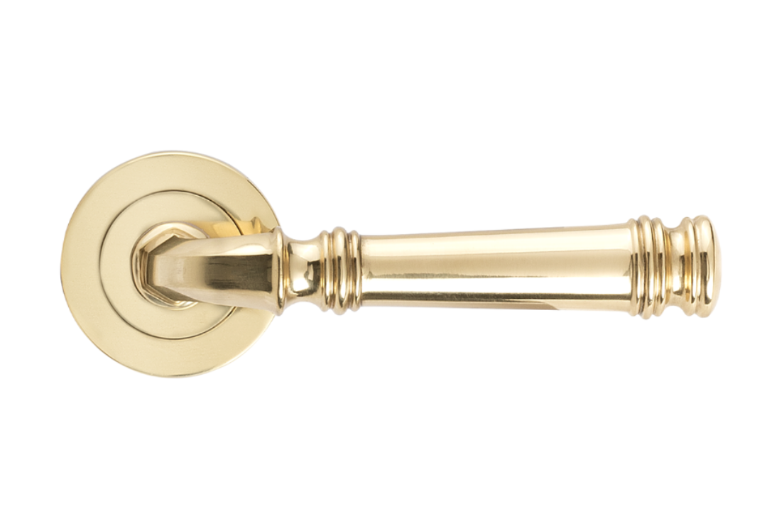 Product image of the Apollo Design Tuscany Door Handle on Round Rose Pair Polished Brass on a white background.