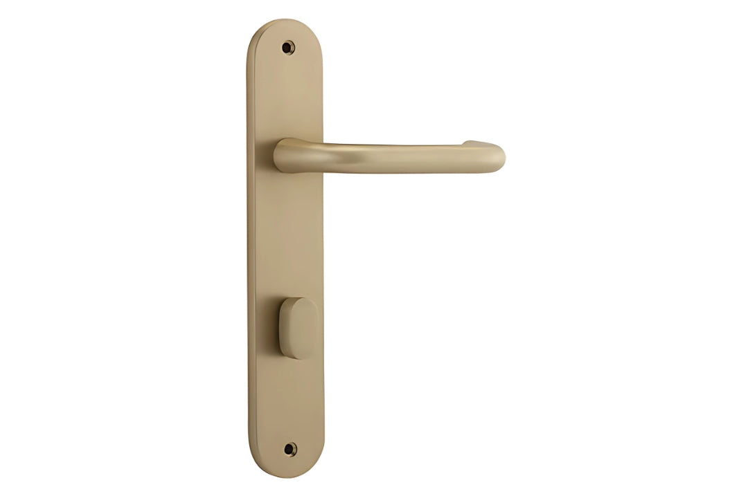 Iver Oslo Lever Handle on Oval Plate Privacy in Brushed Brass – Architectural brass door handle for luxury projects.