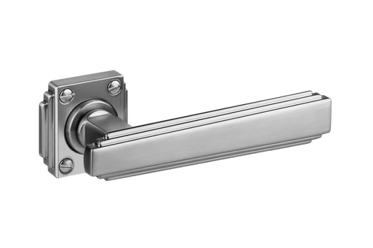 Art Deco Collection On Rose satin stainless handle with rosette — premium art deco door hardware on a white background.