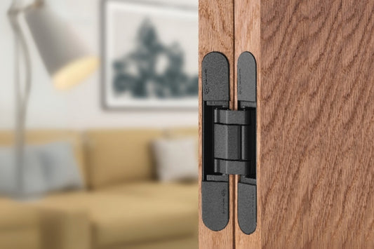 Insitu image of the IN.05.061.B Coplan Hinge on a wooden door with a blurred out background.