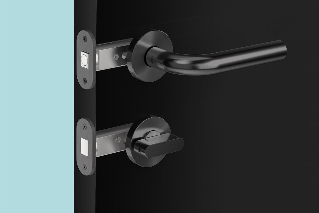 Insitu image of the Matt Black Privacy Bolt installed on a black door with a generic lever set.