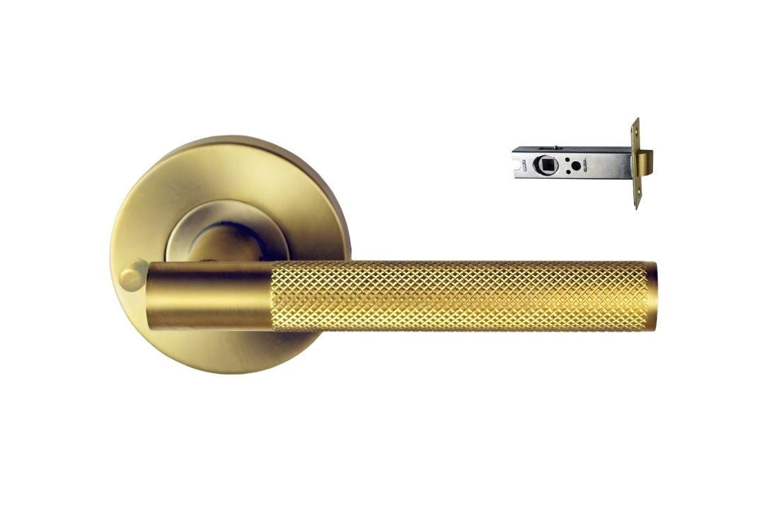 Nidus Knurled Domici Lever on Rose with privacy button, in Satin Brass with latch for privacy set.