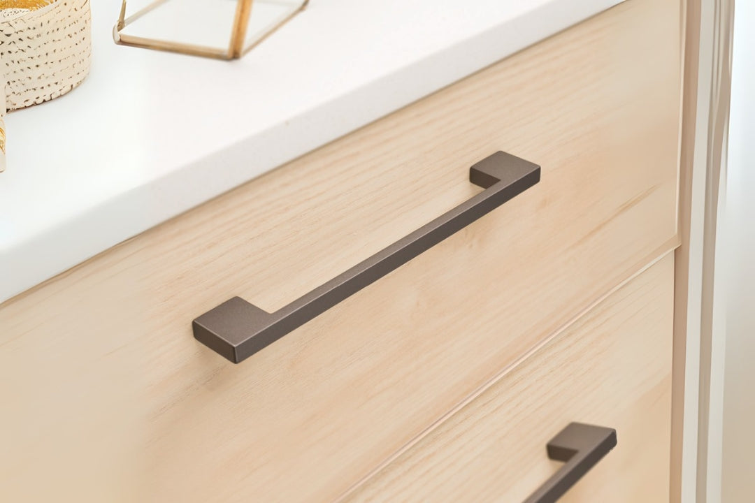 Kethy Binda Cabinet Handle in Matt Graphite installed on a wooden vanity – Designer cabinet pull for minimalist joinery.