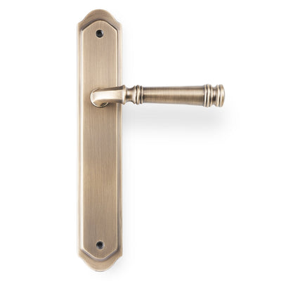 The Apollo Design Tuscany lever handle on traditional plate in antique brass on a white background.