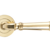 Product image of the Apollo Design Tuscany Door Handle on Round Rose Pair Polished Brass on a white background.