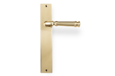 Product image of the Apollo Design Tuscany Door Handle on Rectangle Plate Polished Brass passage set on a white background.