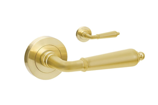 Gold door handle on a white background