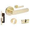Product picture of the Zanda Duke Door Lever Handle on Round Rose Satin Brass entry set with a key/key cylinder, on a white background.