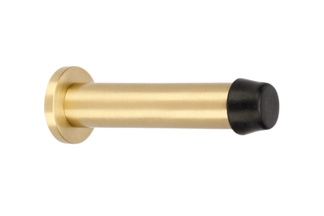 Product image of the Satin Brass Pencil Door Stop 85mm on a white background.