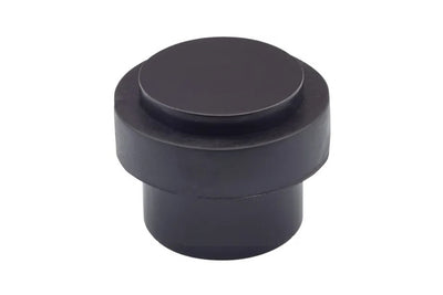 Product picture of the Matt Black Round Floor Door Stop 38mm on a white background.