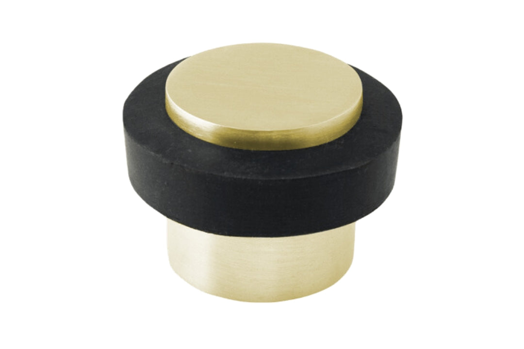 Product picture of the Satin Brass Round Floor Door Stop 38mm on a white background.