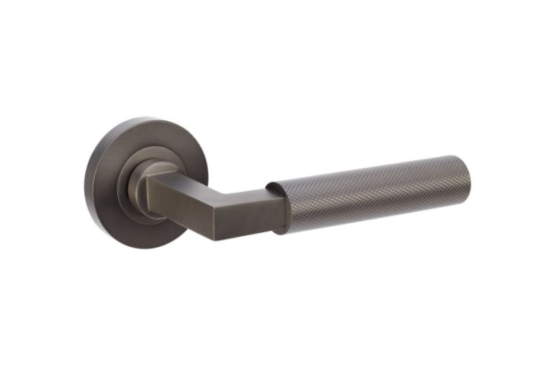 Product image of the Zurich Graphite Nickel Door Handle on a white background.