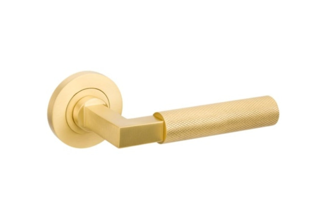 Product image of the Zurich Satin Brass Door Handle on a white background.