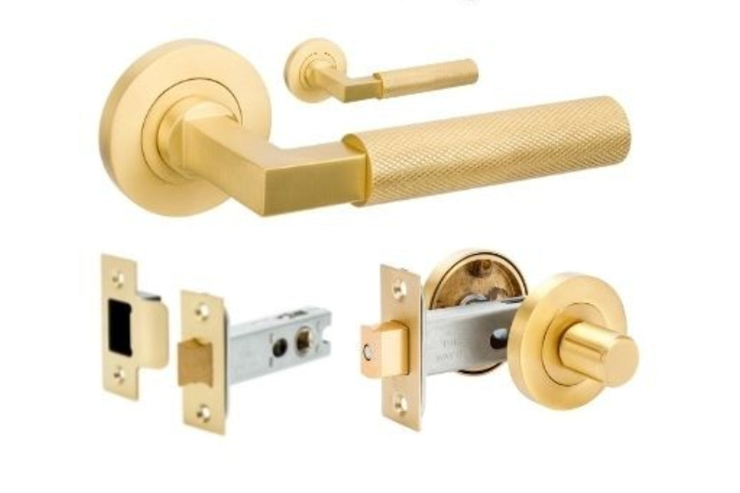 Product image of the Zurich Satin Brass Door Handle Privacy Set on a white background.