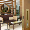 Insitu image of the BRS8104/SET Satin Brass Mardeco Flush Pull Euro Lockset installed on residential wooden doors opening out to an alfresco area.