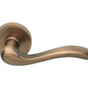 Product image of the Satin Bronze Manital Erica Door Handle Lever Set on Round Rose 50mm on a white background.