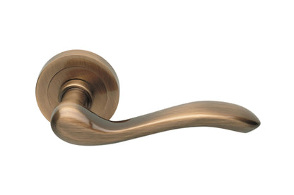 Product image of the Satin Bronze Manital Erica Door Handle Lever Set on Round Rose 50mm on a white background.