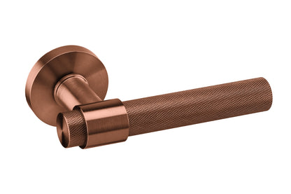 Product image of the IN.00.145.KN.TCO Monaco Titanium Copper Door Handle finished in PVD and distributed by Architectural Choice on a white background.