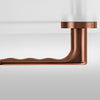 Insitu profile photo of the Yokohama Titanium Copper Door Handles on an off white background.