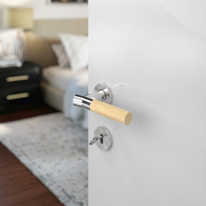 Insitu photo of the Wood Nature Brushed Chrome Bamboo Door Handle on a white door with a bedroom blurred out in the background.
