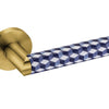 Link porcelain Titanium Gold door handle for luxury architectural interiors on a white background.