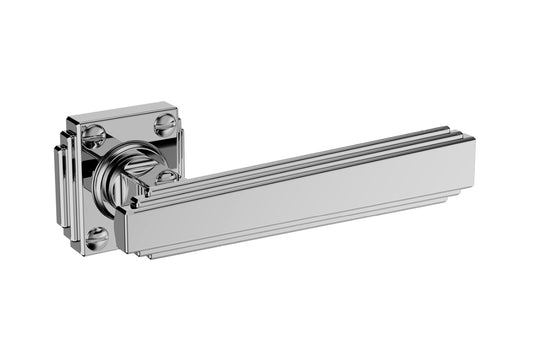 Art Deco Collection On Rose polished handle with rosette — premium art deco door hardware on a white background.
