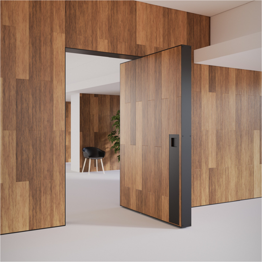 The JNF Hydraulic pivot with hold open 90º and rated for 350kg doors in action. In this photo the IN.05.215.HO is in action on a large timber veneer doors with black trim and a white floor.