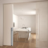 Image of the IN.16.302.M4 Satin Stainless Flush Handle installed on a cream door that is open and looking into a kitchen.