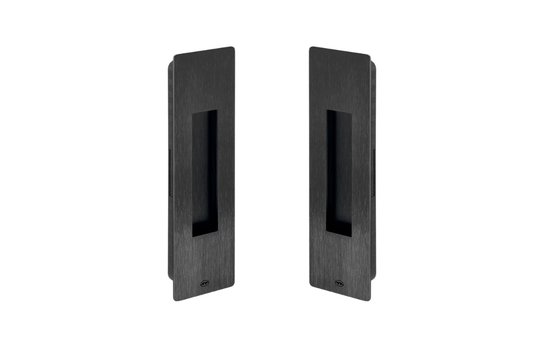 Two black rectangular door handles on a white background
