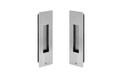 Pair of metallic door handles on a white background