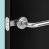 Insitu image of the IN.20.153 Magnetic latch on a black door with a generic stainless steel lever installed.