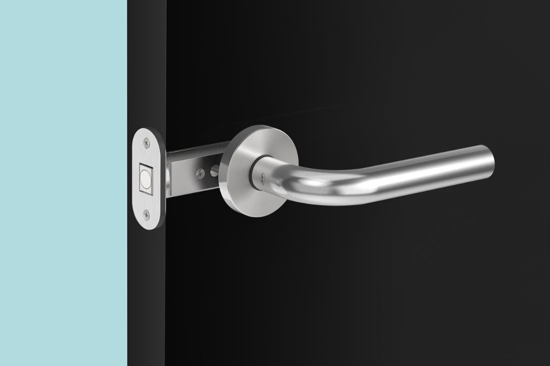 Insitu image of the IN.20.153 Magnetic latch on a black door with a generic stainless steel lever installed.