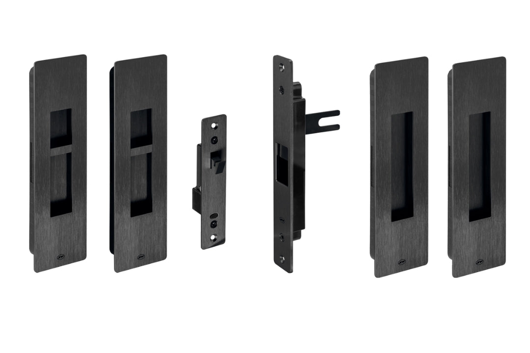 Set of black door hardware components on a white background