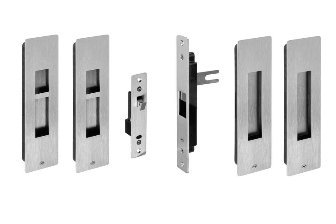 Set of metallic door lock components on a white background