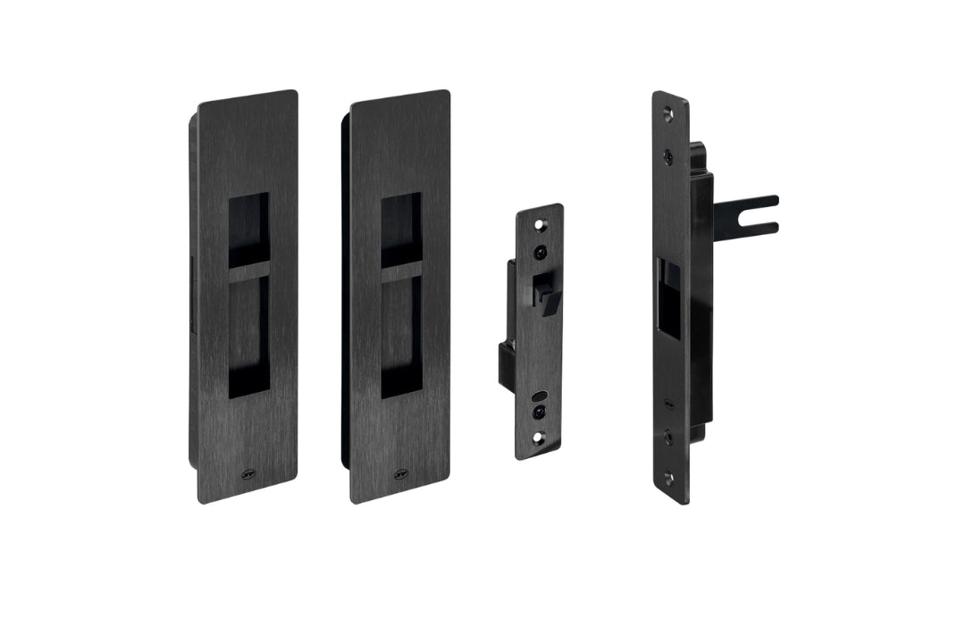 Set of black door hardware components on a white background