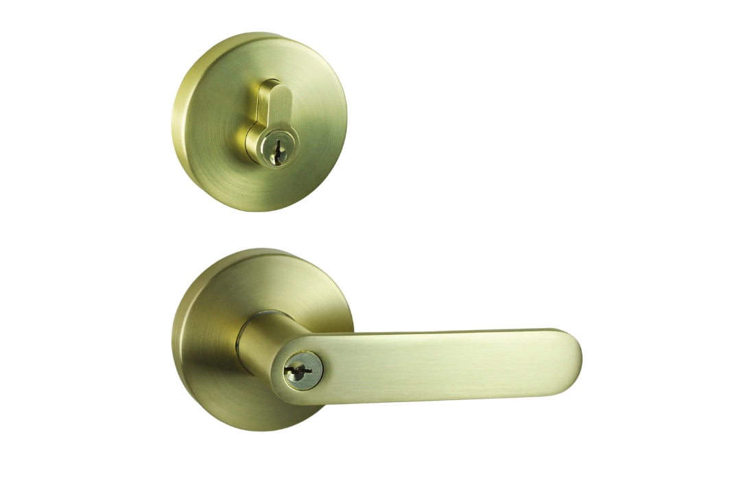 Image of the Satin Brass Nidus Spring Door Lever Round Combo Entrance Set on a white background.