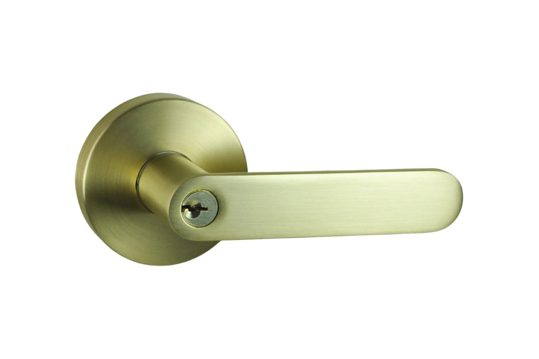Product image of the Satin Brass Nidus Spring Door Lever Round Entrance Set on a white background.