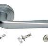 Product picture of the Petra Satin Chrome Door Handle with accessories tubular latch, privacy turn and release, and a privacy bolt on a white background.