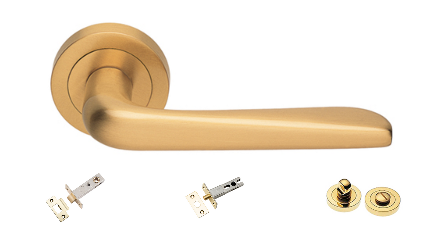 Product picture of the Petra Satin Brass Door Handle with accessories tubular latch, privacy turn and release, and a privacy bolt on a white background.